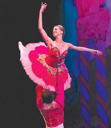 Man lifts ballerina