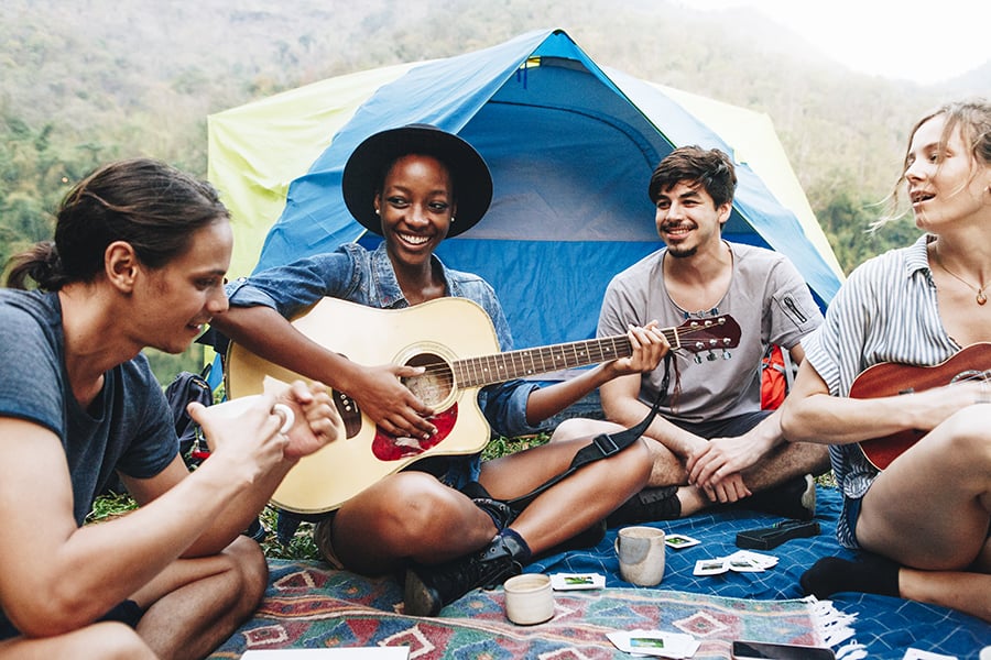 people with instruments camping