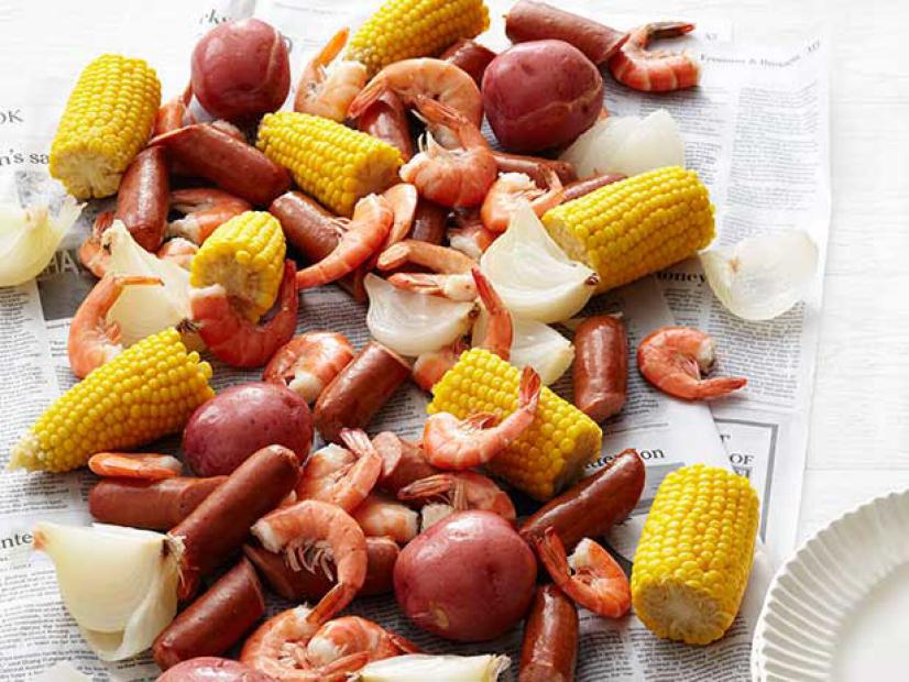 Shrimp, corn, potatoes and onions.