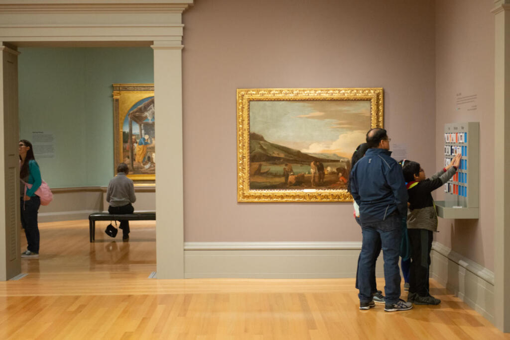 people looking around in a musuem
