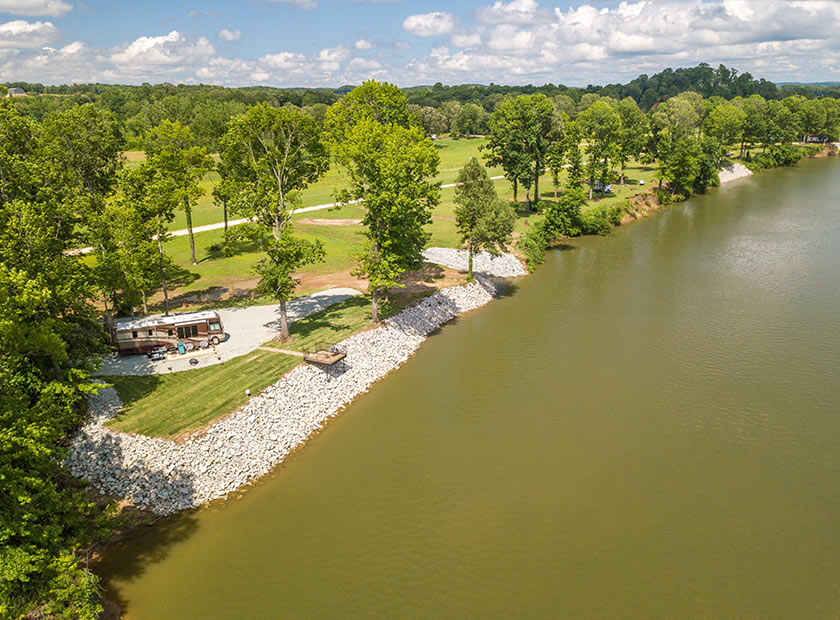 Aerial view of Lake Kentucky, showcasing green trees and an RV.
