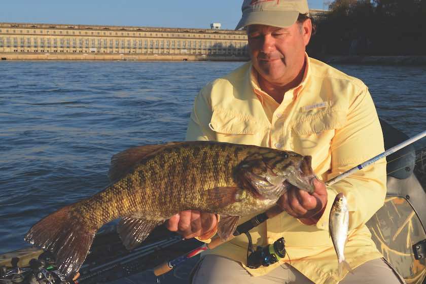 Fishermen holding a smallmouth bass