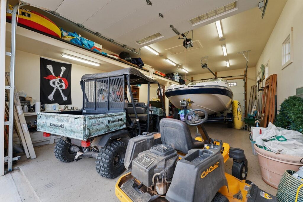 boathouse with a boat, vehicles, and a  pirate flag