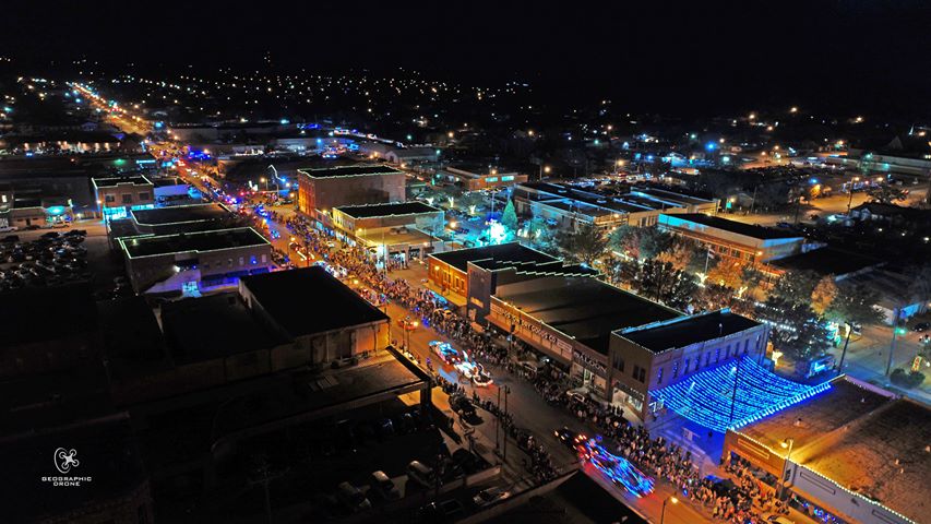 Aerial photo of Mineral Wells, TX.
People and Christmas lights on street.