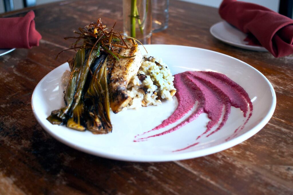 Fish with leeks over rice with a purple sauce---an example of The Walnut  Kitchen's excellent food. 