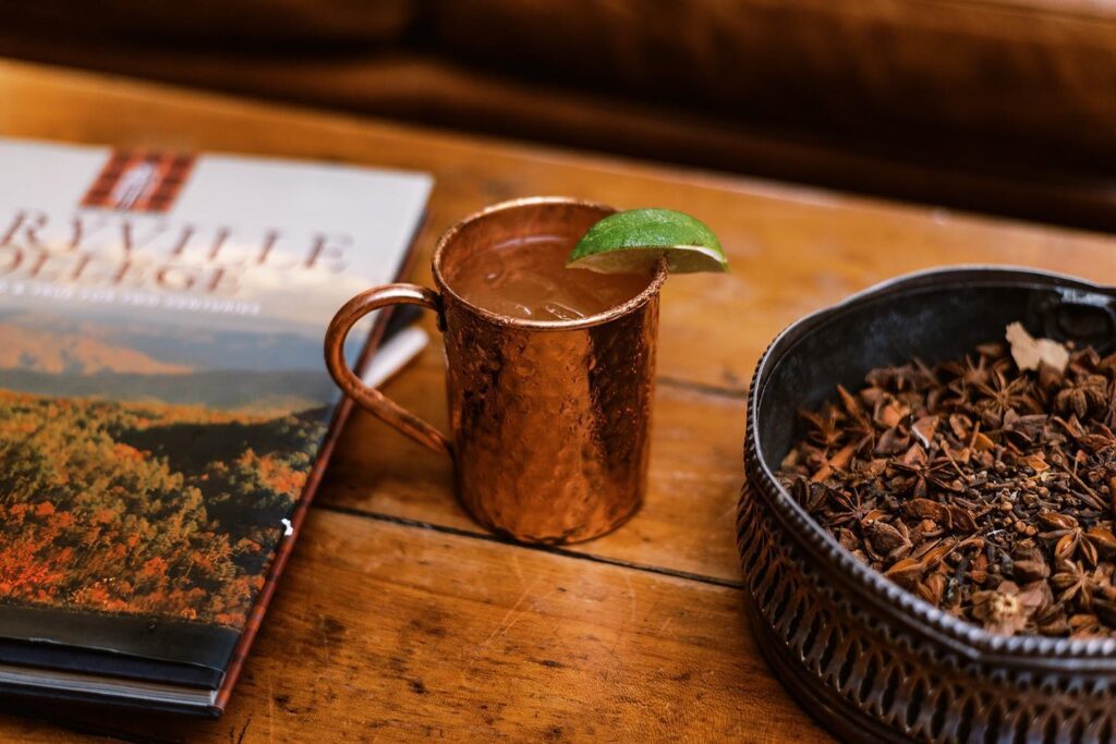 A Moscow mule on a wood table. 
