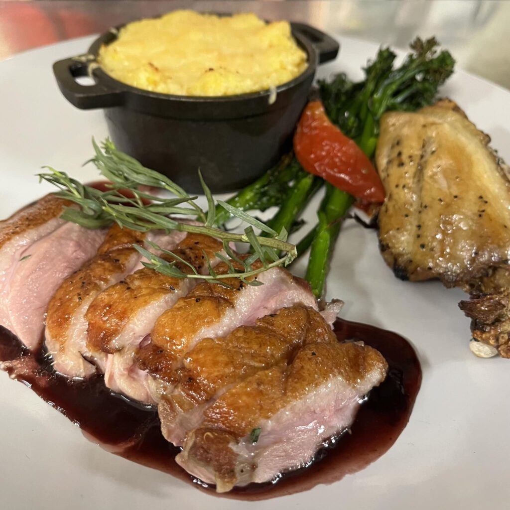 Juicy pork with greens and grits---an example of Foothills Milling's stellar menu. 