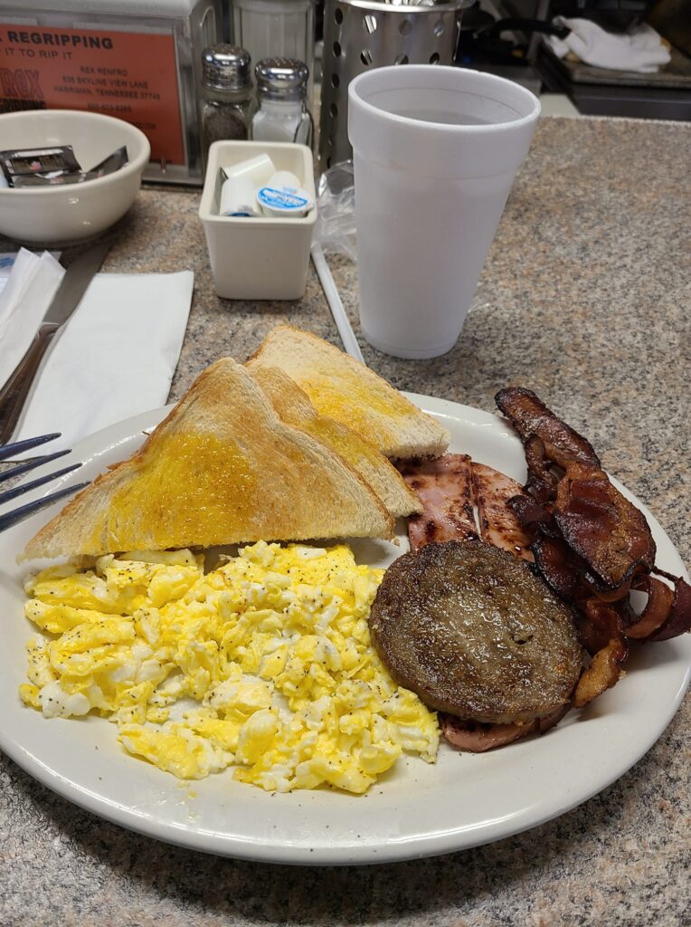 Meat lover's breakfast plate---toast, eggs, sausage, and bacon