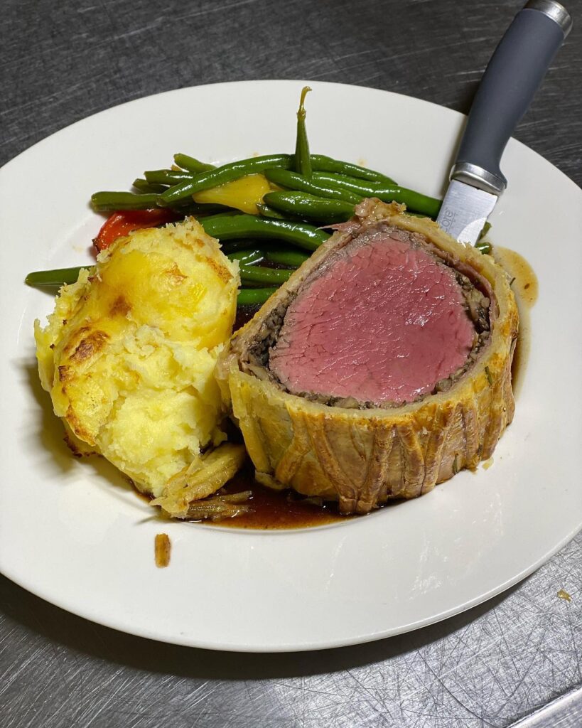 Beef wellington, potato, and green beans