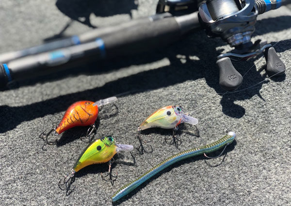 a rod on the ground with lures