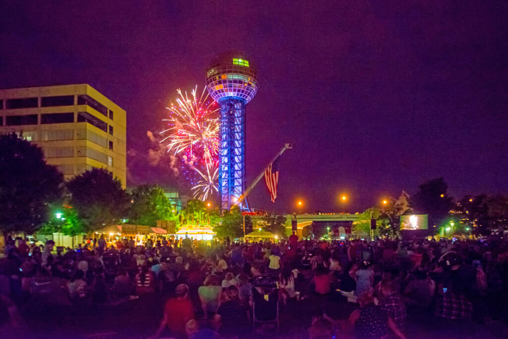 a crowd, disco ball, and fireworks in Knoxville
