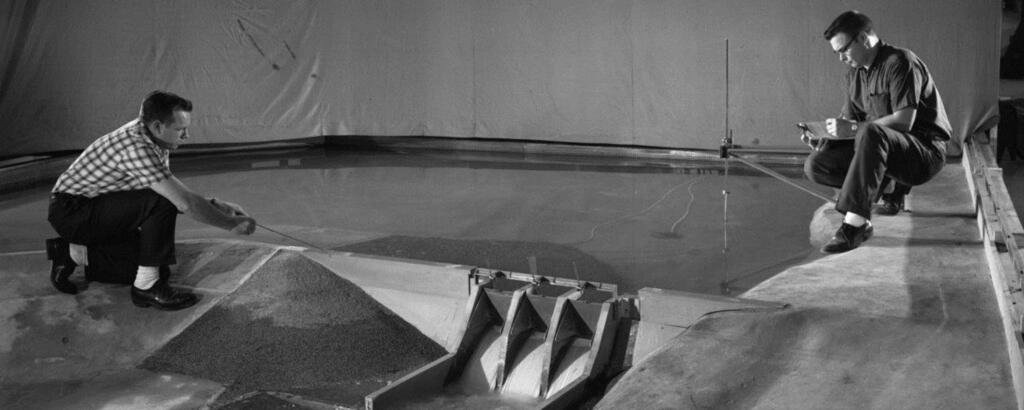 architects looking at a recreation of Tellico Dam