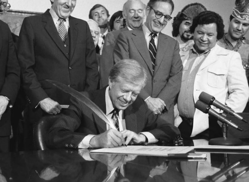United States President Jimmy Carter signing a document