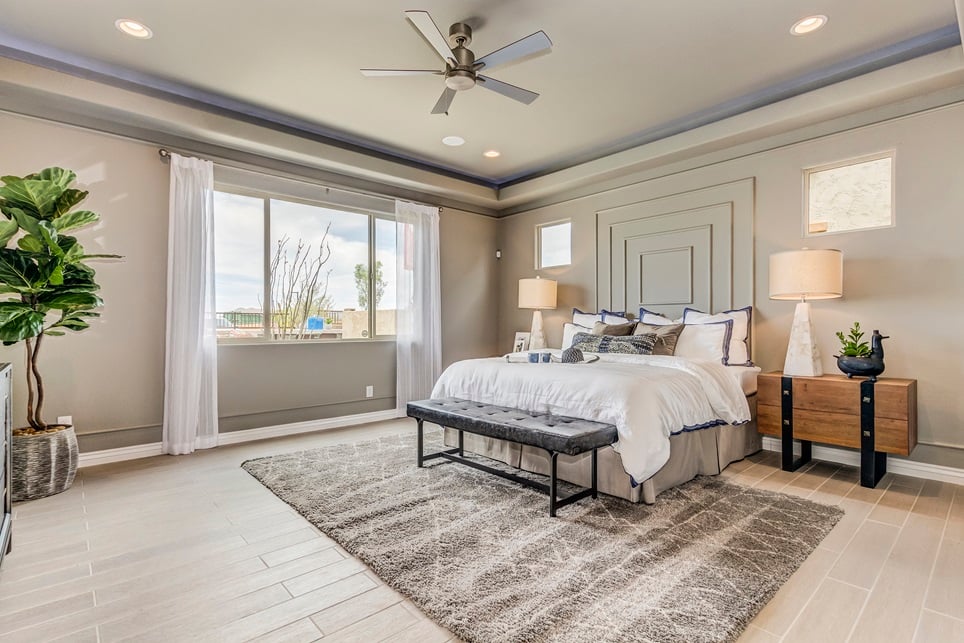 Bedroom white modern furniture and beige accents.