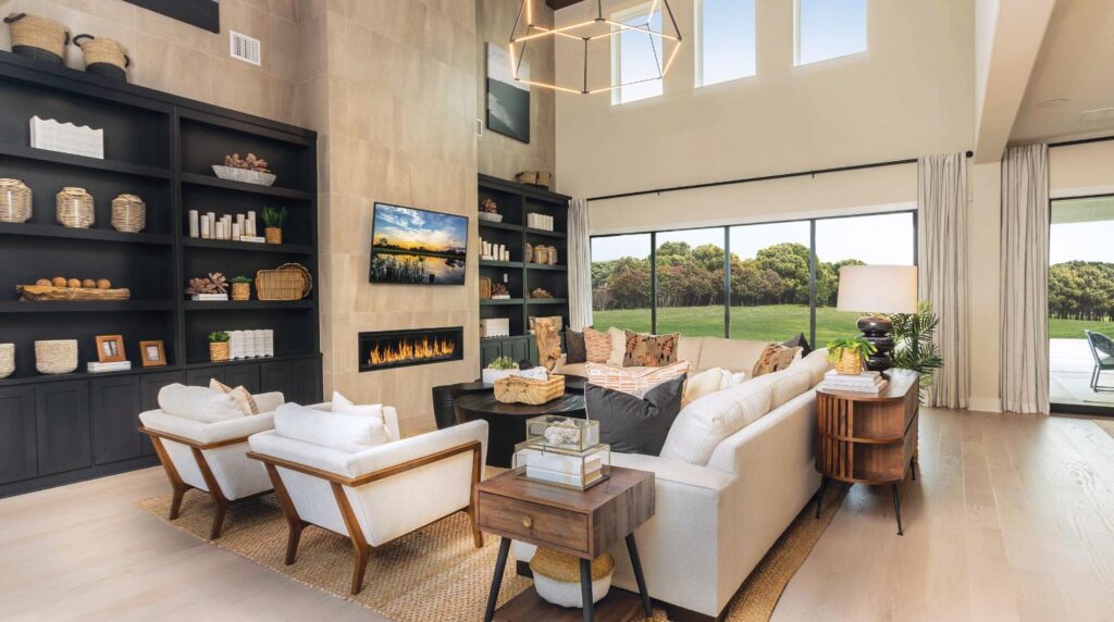 Large living room with modern fireplace and furniture.