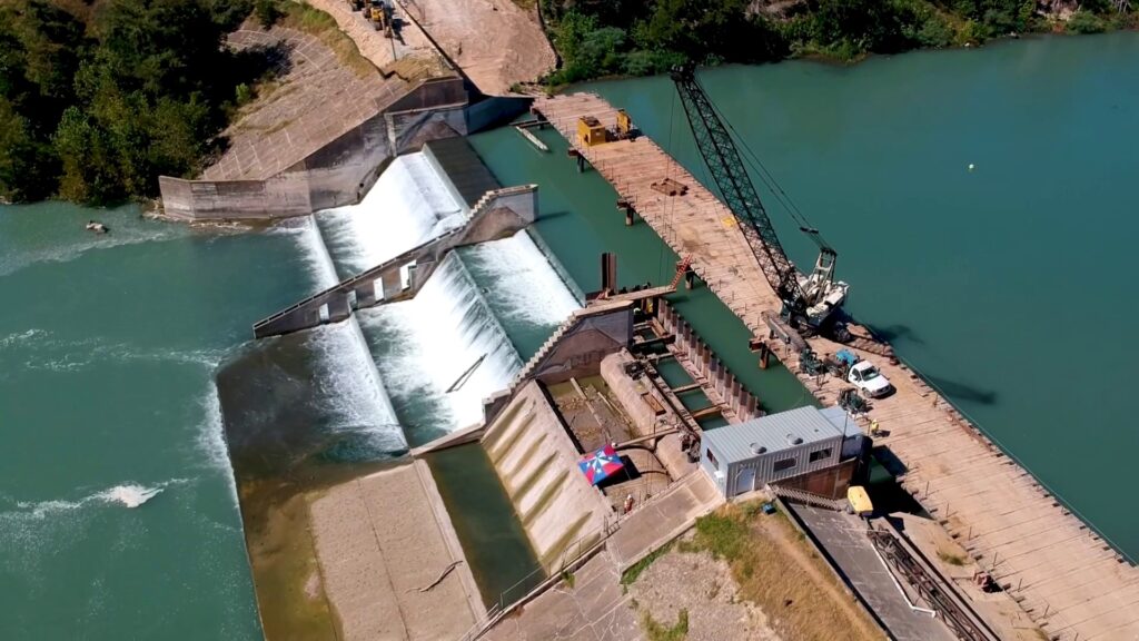 Lake Dunlap Dam under construction with a building equipment