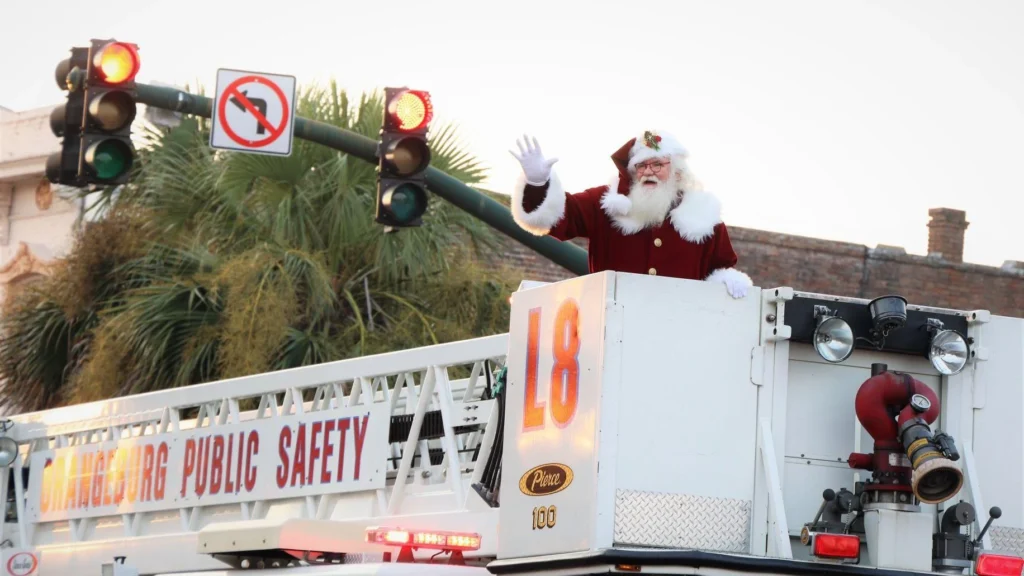 Santa on a float that reads Orangeburg public safety. 